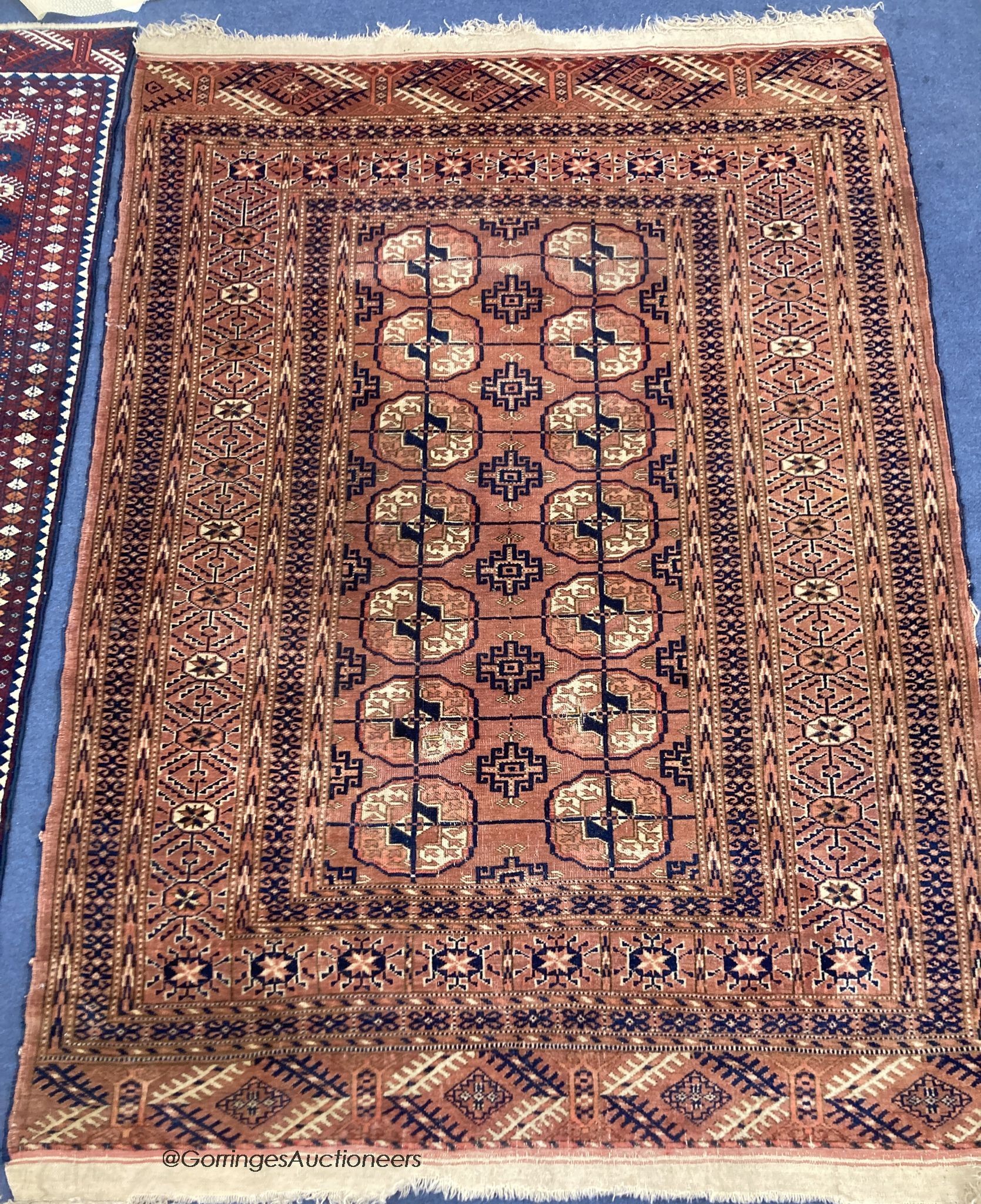 A Bokhara red ground rug, 150 x 116cm